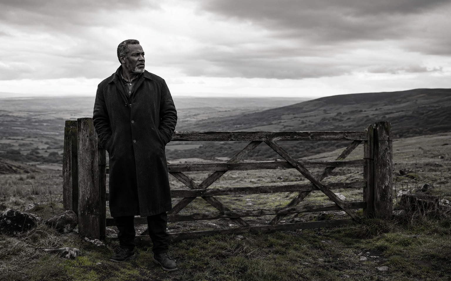 A Caribbean veteran standing on a windswept Welsh hillside