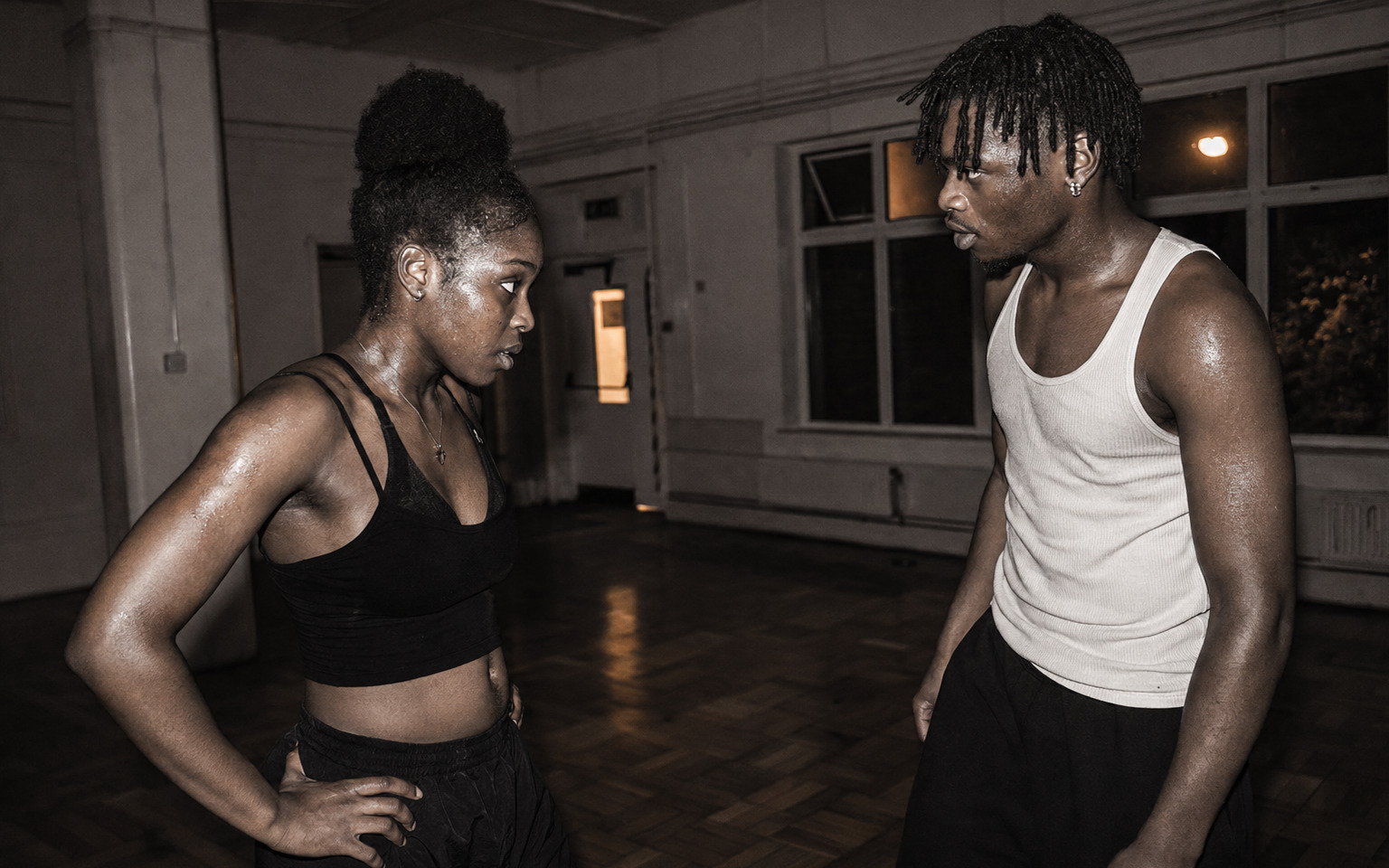 Two dancers facing one another in a South London dance space